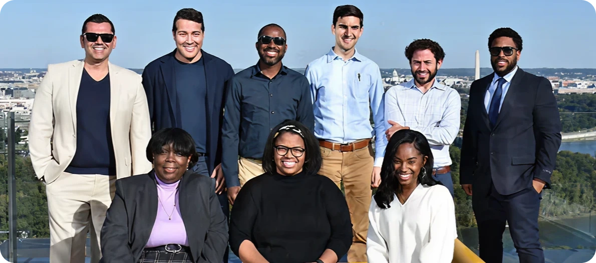 DKC staff members posing and smiling outdoors