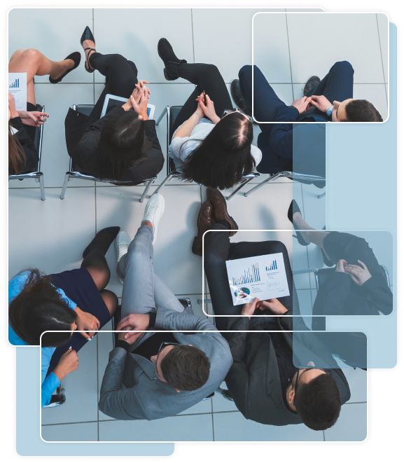 People sitting in a circle discussing charts