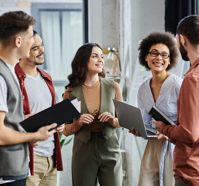 Group of colleagues having a discussion and smiling