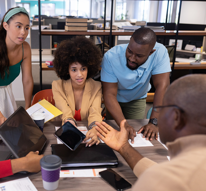 People collaborating and discussing at a table