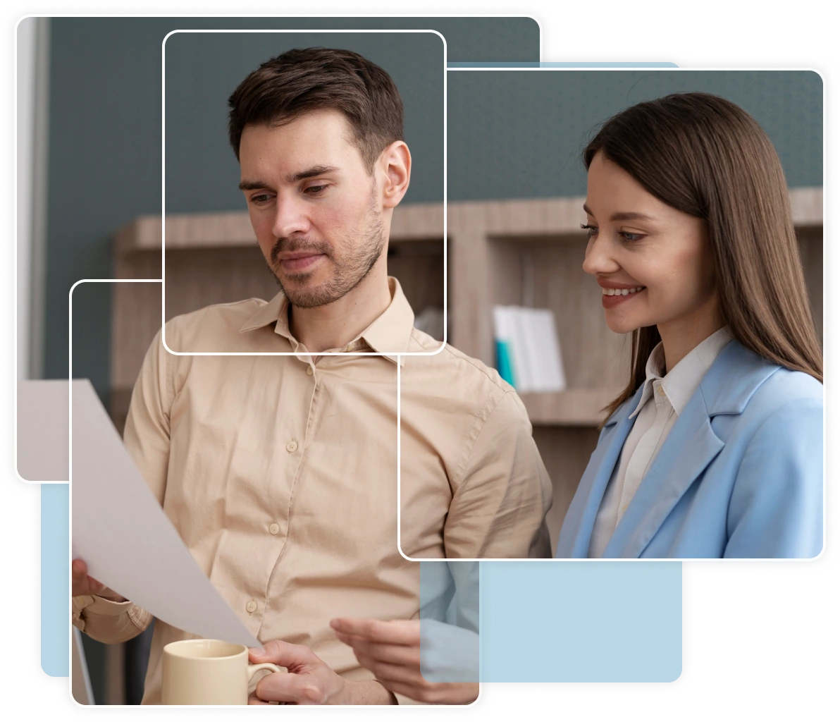 Two coworkers reviewing a document in an office.